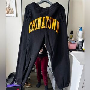 Chinatown Market Black Sweatpants with Yellow Lettering